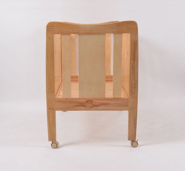 Natural Wooden Baby Crib Front view of natural wooden baby crib with open slatted sides