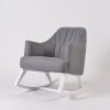 Gray upholstered nursery rocking chair with white wooden rocking base