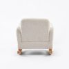 Upholstered Kids Rocking Chair – Rear View Rear view of cream upholstered kids rocking chair showing padded backrest and wooden rocker base