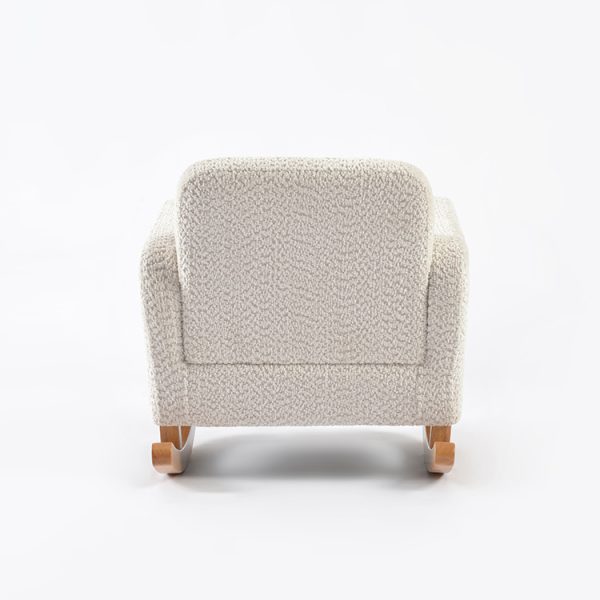 Upholstered Kids Rocking Chair – Rear View Rear view of cream upholstered kids rocking chair showing padded backrest and wooden rocker base