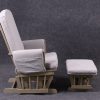 Side view of high back nursery glider chair with cushioned armrests and ottoman