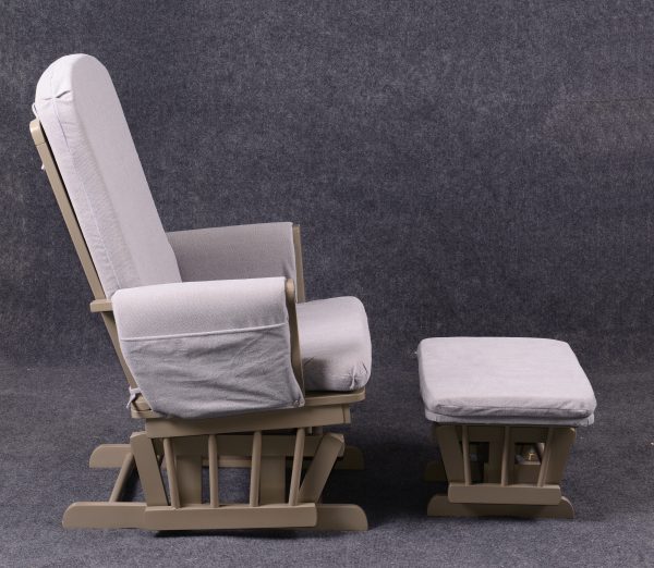 Side view of high back nursery glider chair with cushioned armrests and ottoman