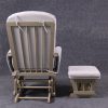 Back view of wooden nursery glider showing the exposed wooden frame and matching ottoman