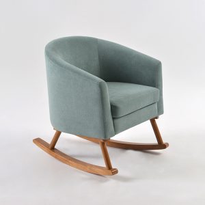 Upholstered Kids Rocking Chair – Angled View Upholstered kids rocking chair in green fabric with curved wooden rocking base