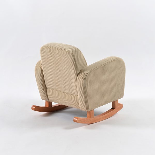 Rear angled view of beige corduroy baby rocking chair with upholstered back and natural wooden rockers