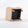 Underside view of convertible kids chair showing wooden leg attachment points for interchangeable base configuration