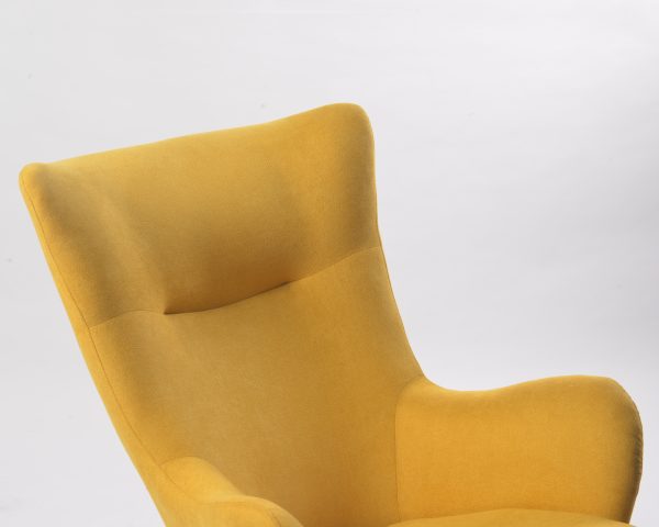 Close-up of mustard upholstered wingback rocking chair back