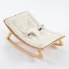 Wooden Baby Rocker with Padded Seat Wooden baby rocker with soft cream padded seat and curved rocking base