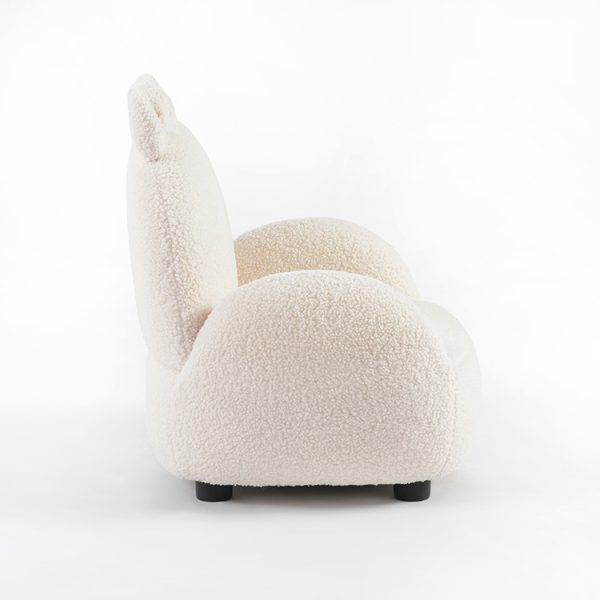 Cream upholstered kids armchair with curved padded sides and animal-ear details