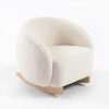 Cream bouclé kids rocking chair with curved wooden rockers and wraparound backrest
