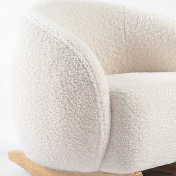 Close-up of natural wooden rocker base on cream upholstered kids rocking chair