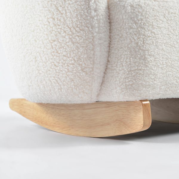 Close-up of soft cream bouclé upholstery on rounded kids rocking chair