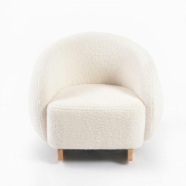 Cream bouclé kids rocking chair with curved wooden rockers and wraparound backrest